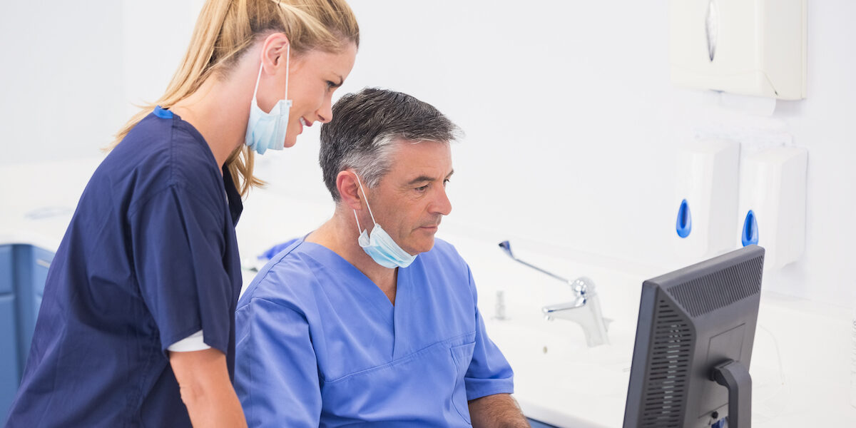 dentist and manager ordering dental supplies